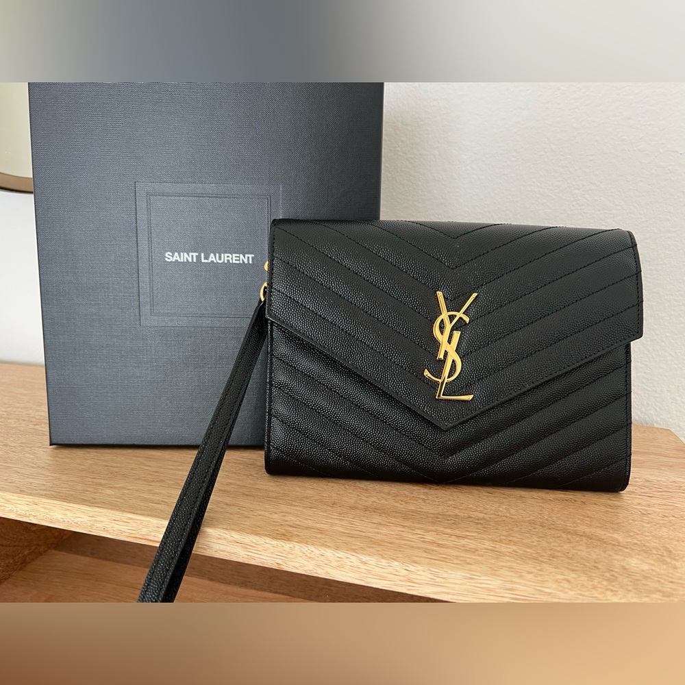 Saint Laurent Matelasse Pouch in black and gold.